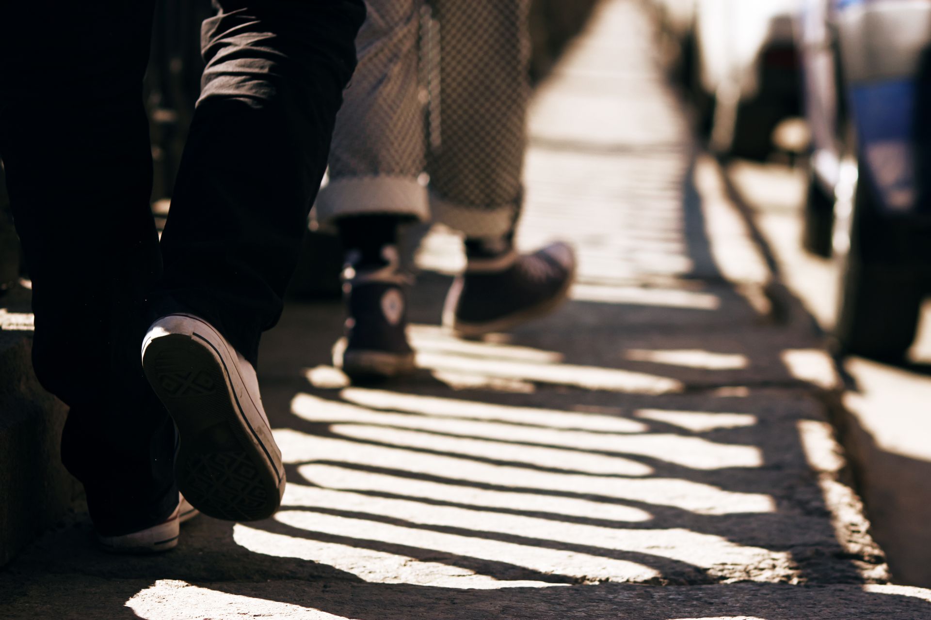 A group of people are walking across a zebra crossing.