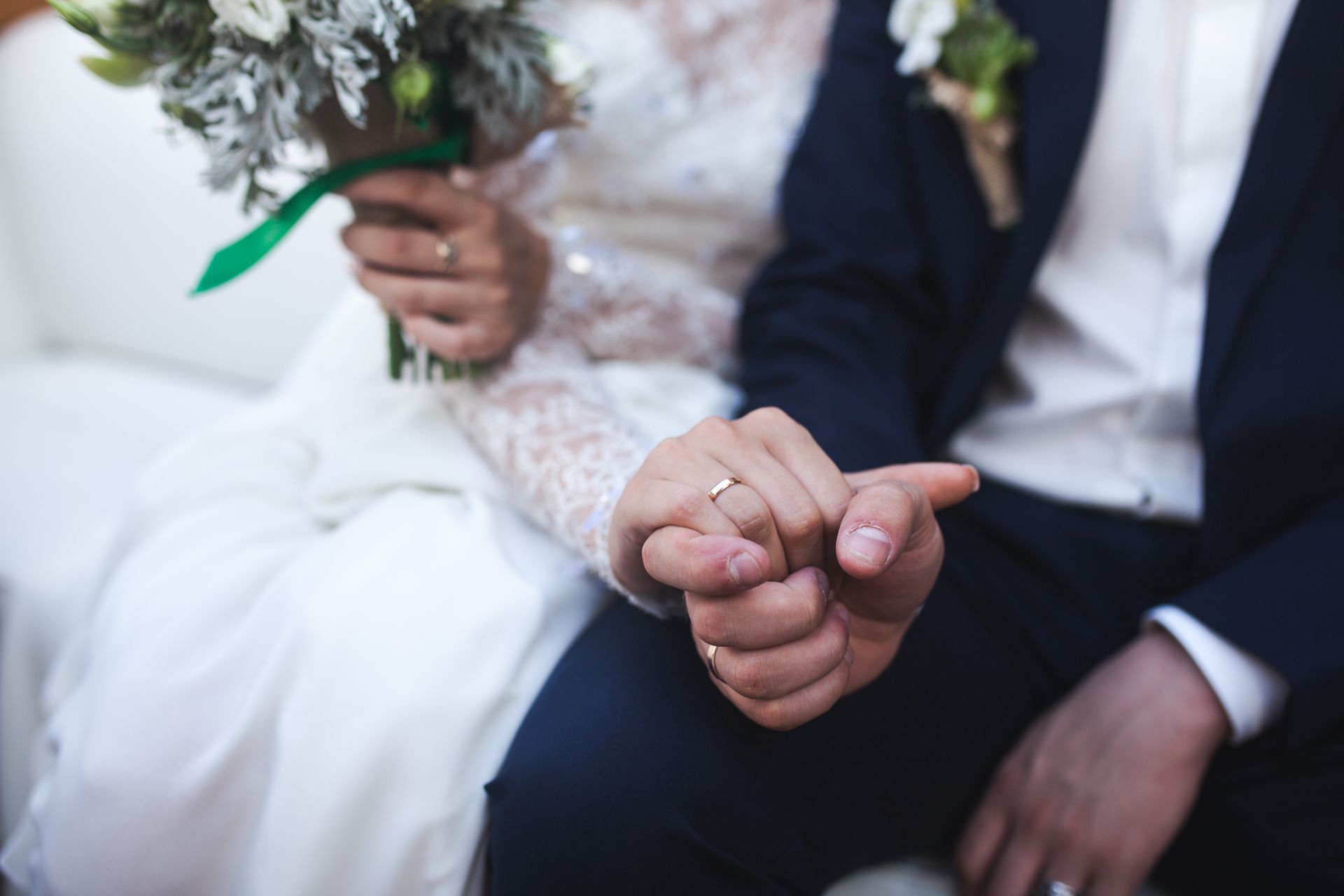 A married couple holding hands symbolizing marriage based immigration in Tampa, FL.