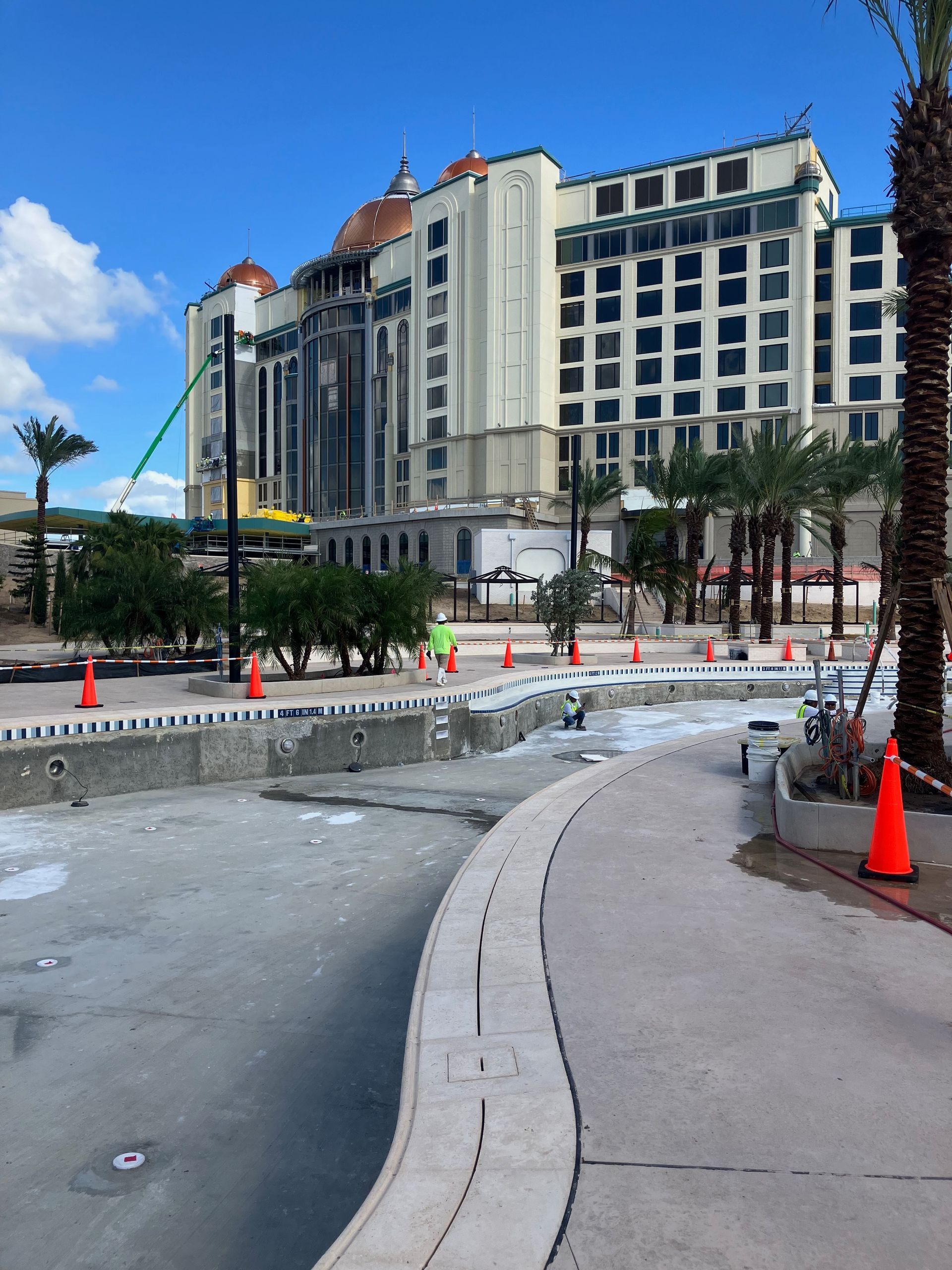 A large building is in the background of a construction site