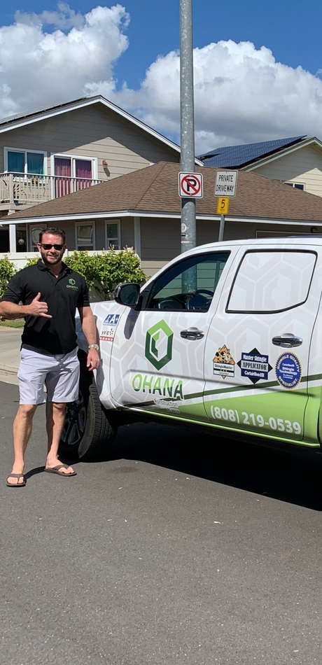 satisfied customer standing next to wrapped work truck