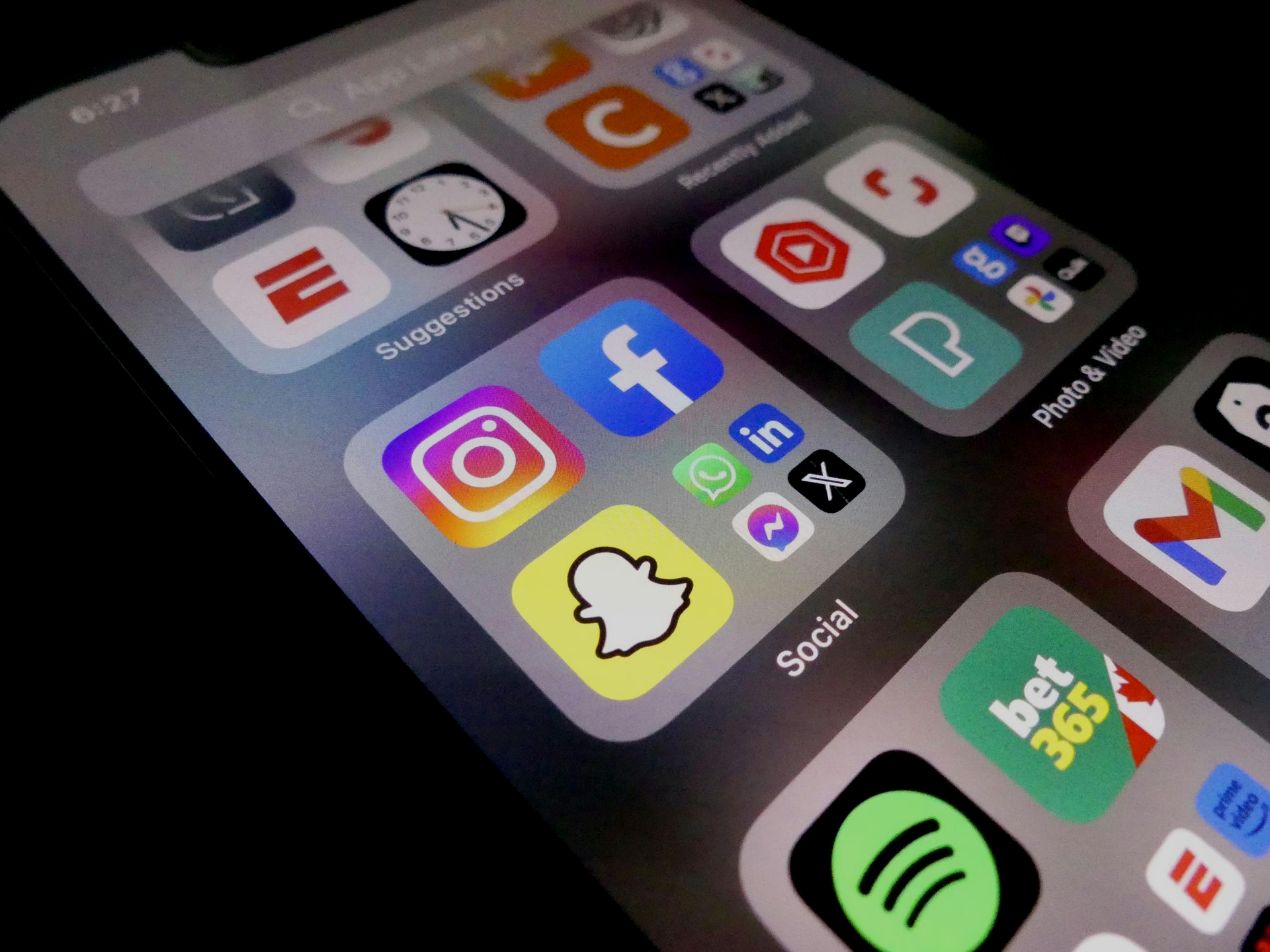 A phone screen showing apps such as TikTok for which Growth Reach Digital offers ad services