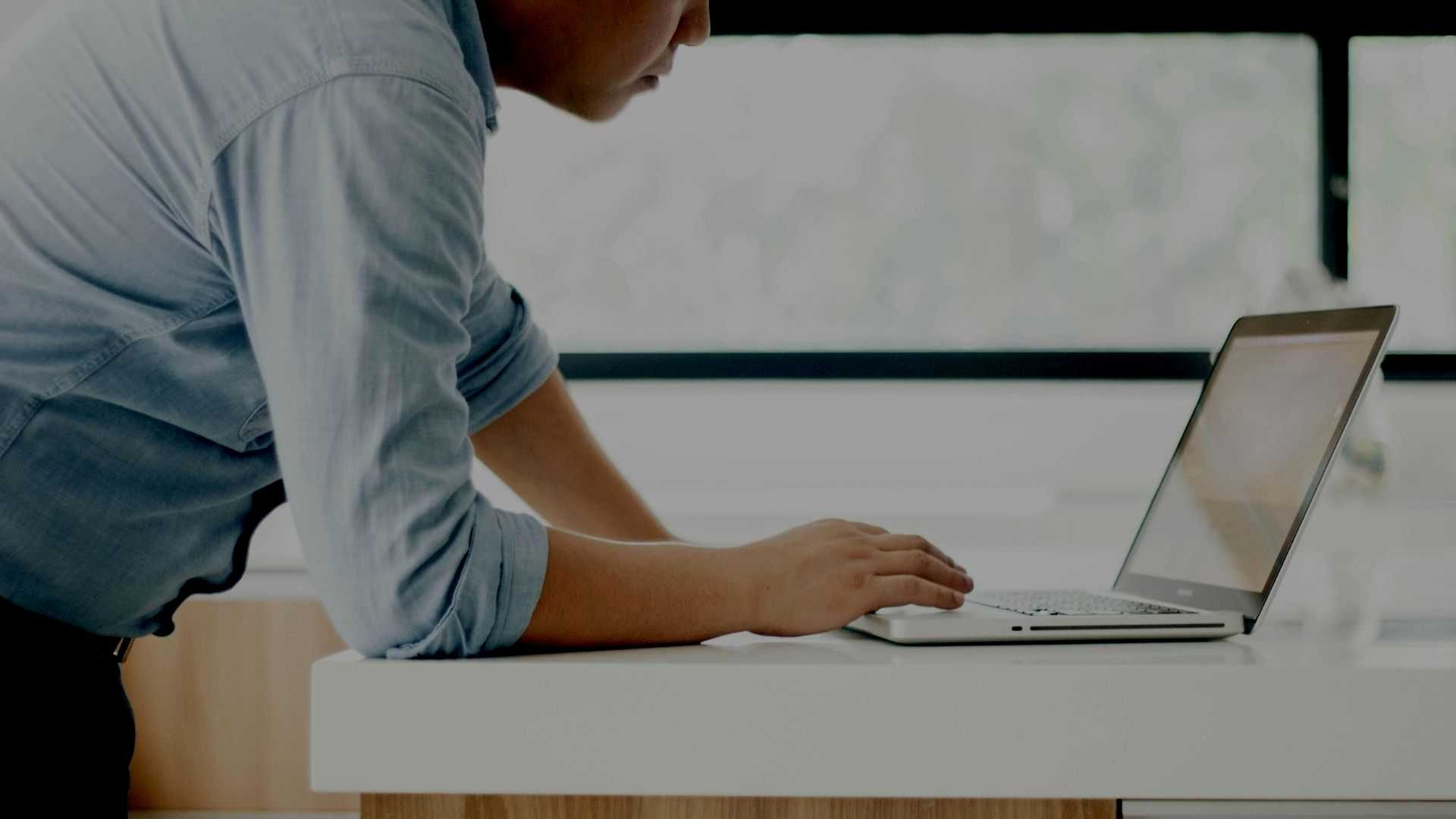 Man looking at SEO campaign results on laptop