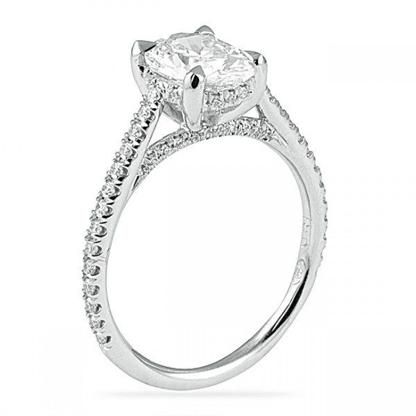 White gold engagement ring with pavé diamond band and hidden halo setting