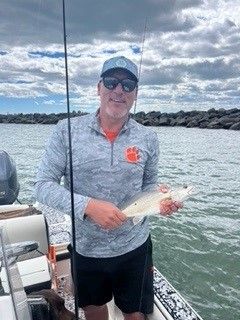 Man Holding a Fish — Murrells Inlet, SC — Diamond Nautical