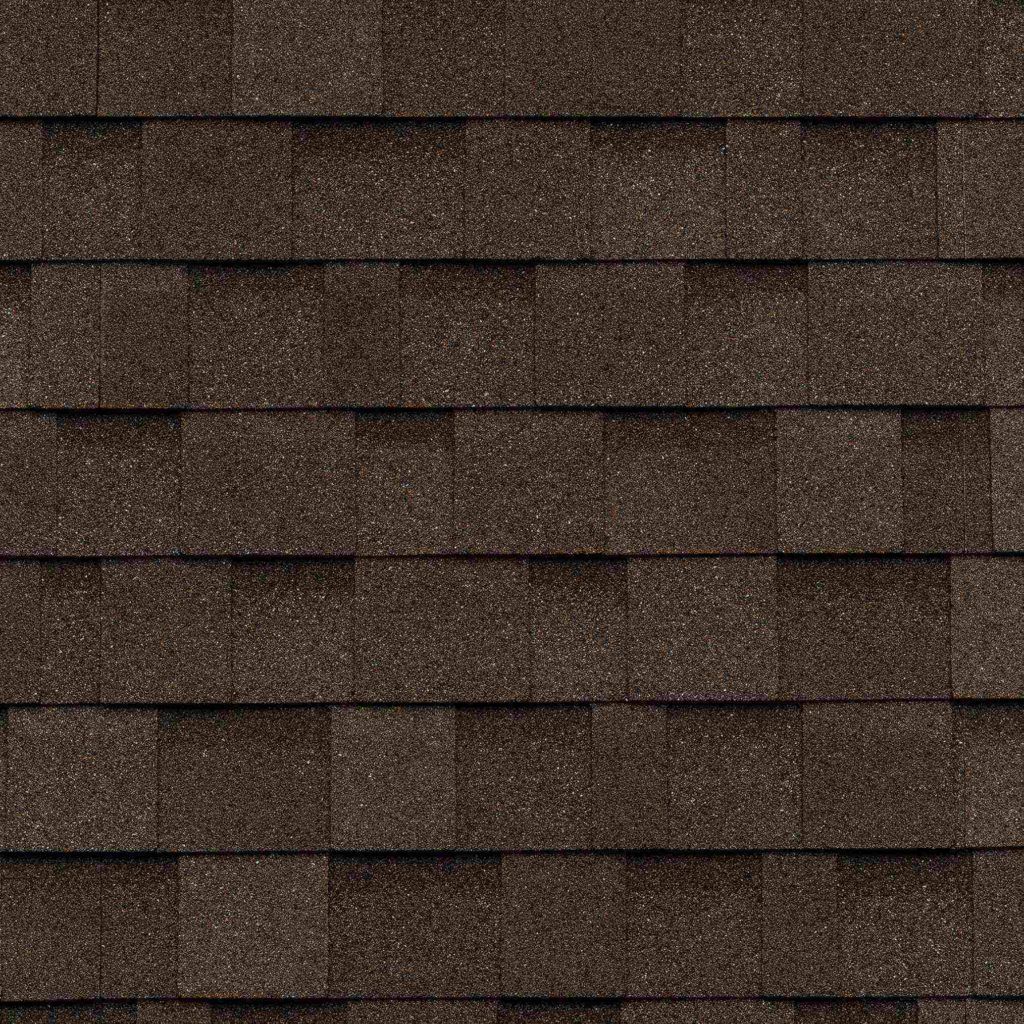 A close up of a roof with brown shingles.