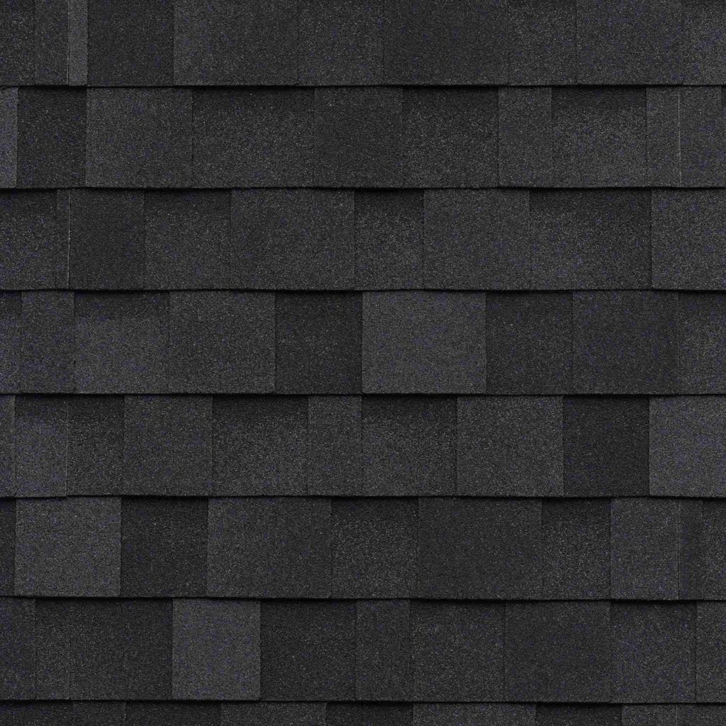 A close up of a roof with black shingles.