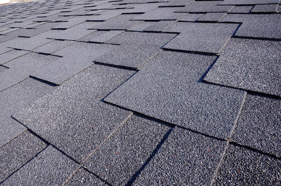 A close up of a roof with shingles on it