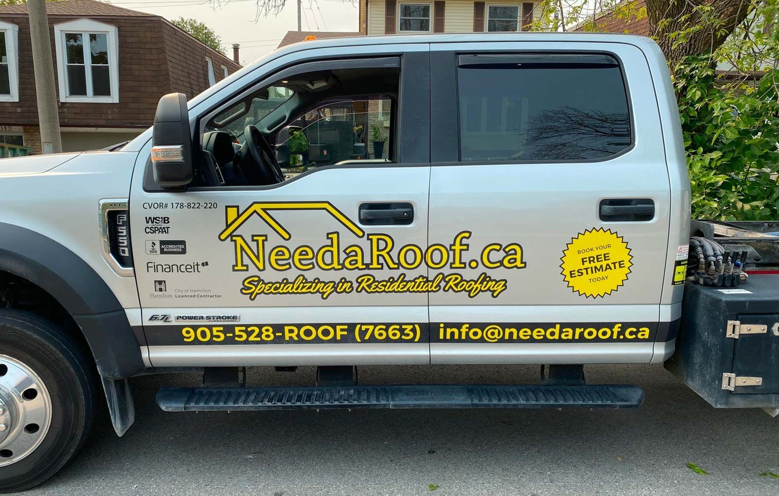 A truck that says needaroof.ca on the side