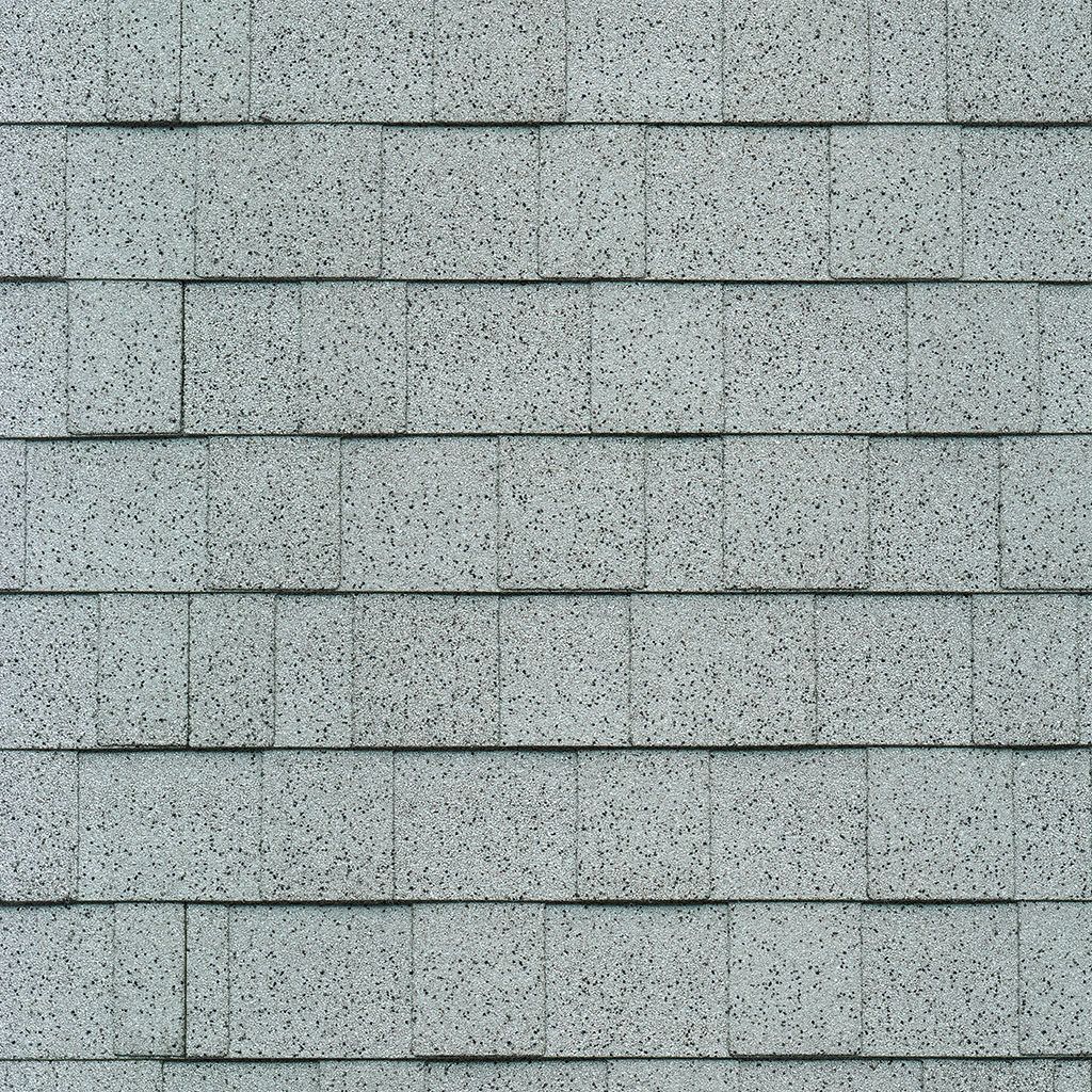 A close up of a gray brick wall.