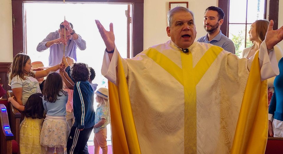 priest giving blessing

