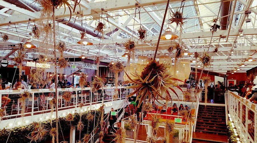 A large building with a lot of food markets.