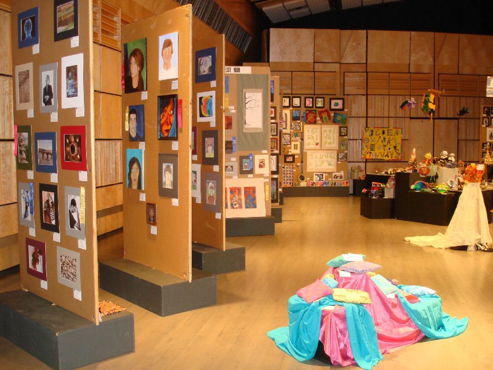 A room with paintings on the walls.