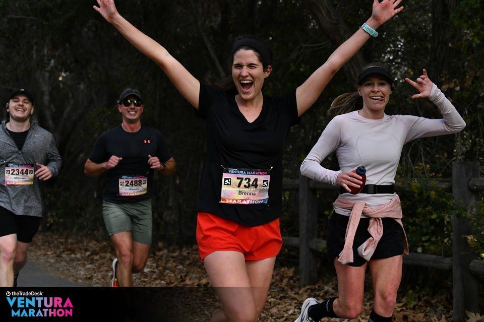 Female runner arms raised Ventura Marathon