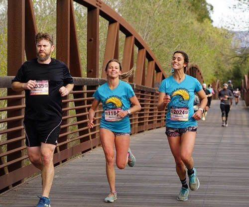 Ventura Marathon Participants running over the bridge image