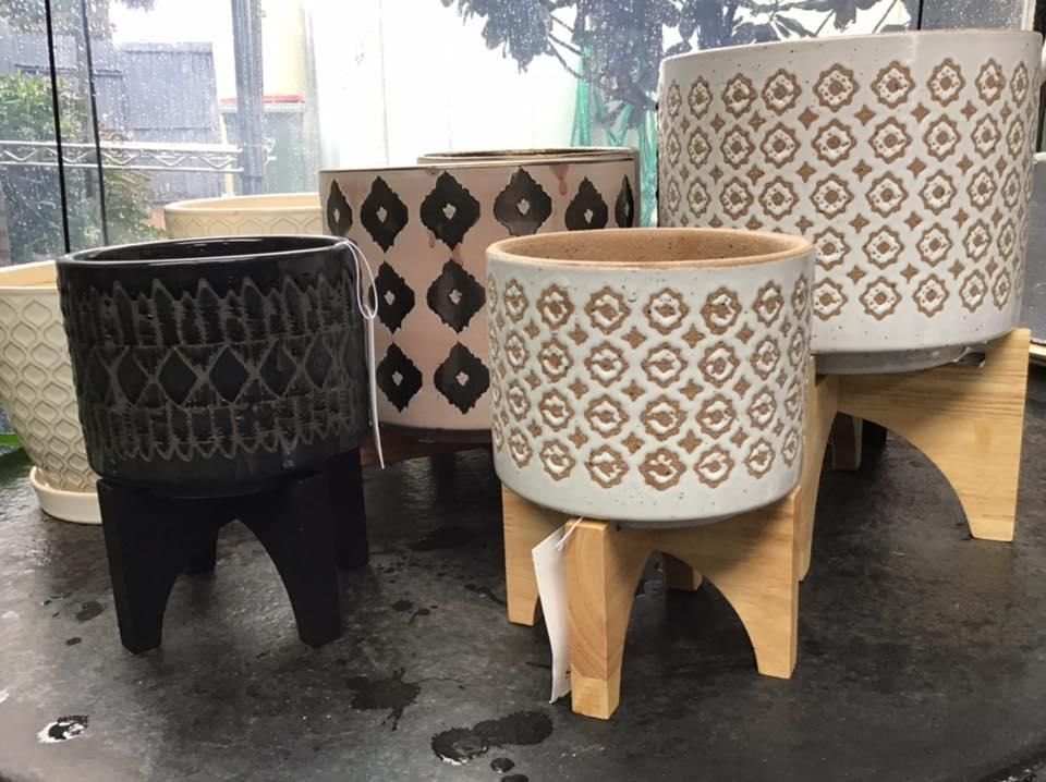A Group Of Pots Sitting On Top Of Each Other On A Table — Magnolia Nursery In Dubbo, NSW