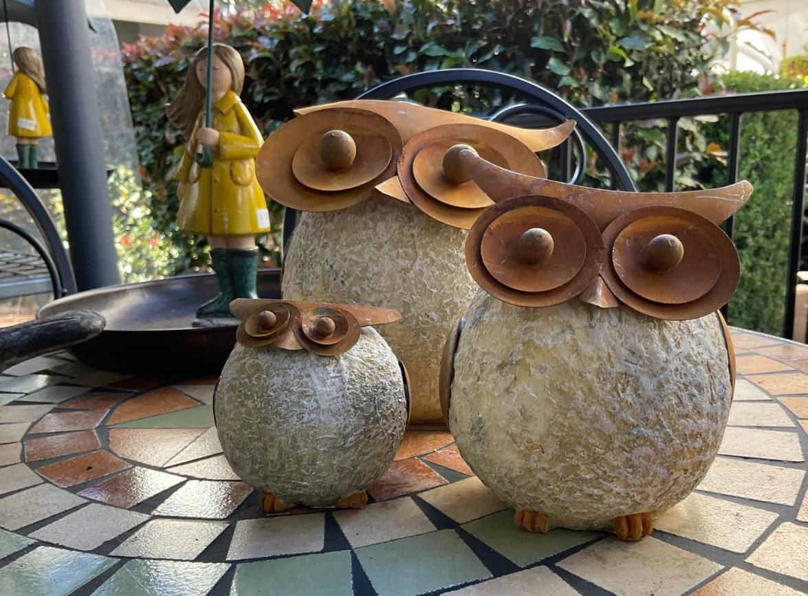 Three Owls Are Sitting On A Mosaic Table — Magnolia Nursery In Dubbo, NSW