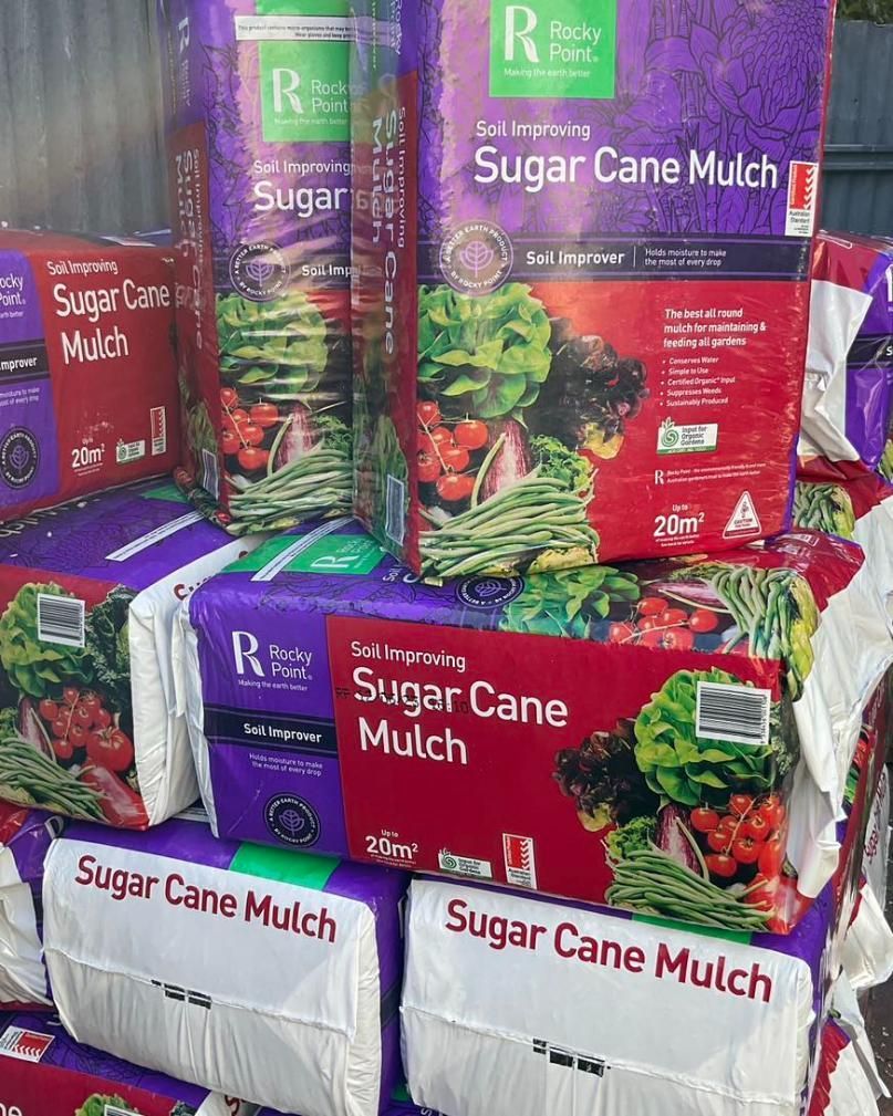 A Bunch Of Bags Of Sugar Cane Mulch Are Stacked On Top Of Each Other — Magnolia Nursery In Dubbo, NSW