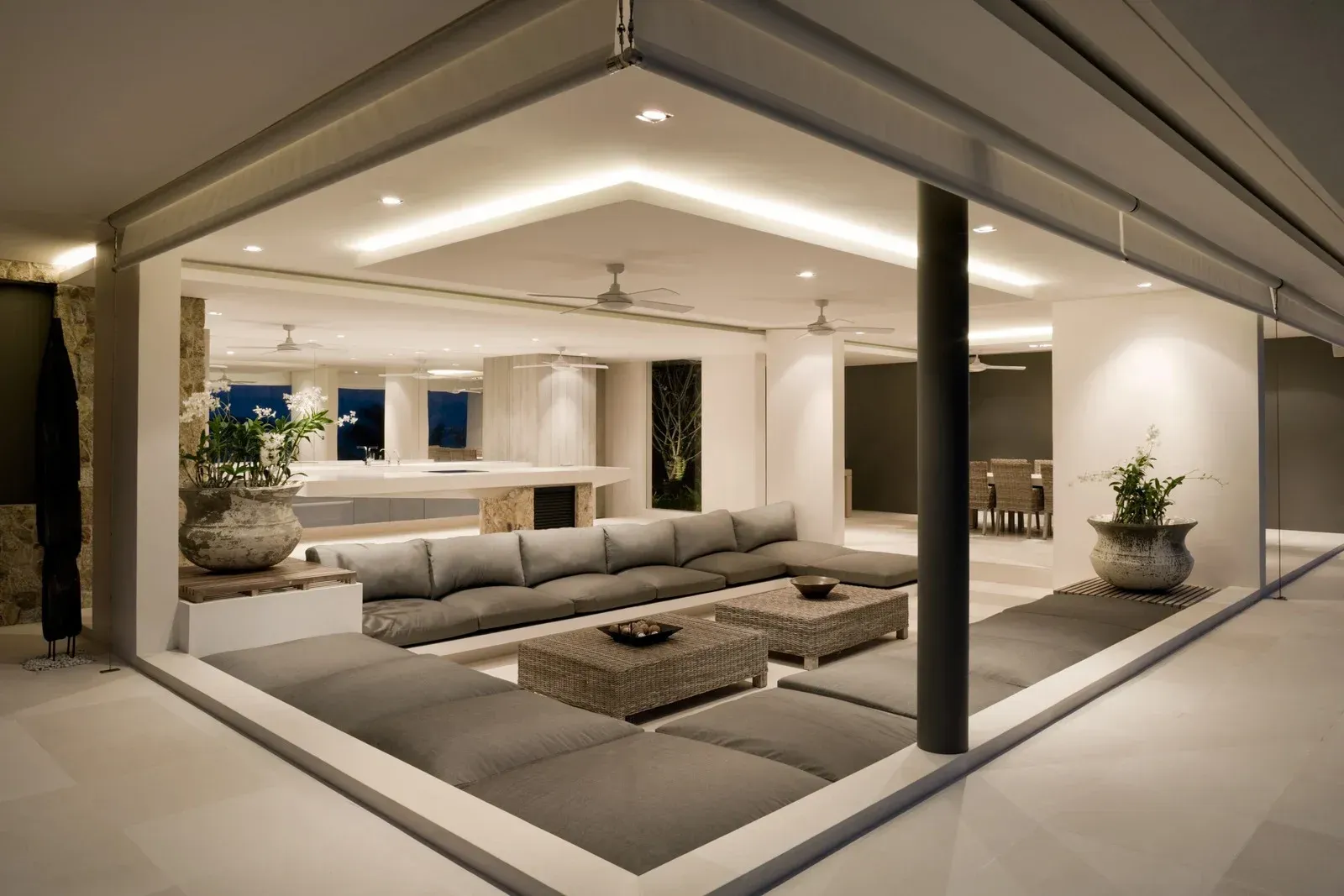 A living room with a lot of furniture and a large window