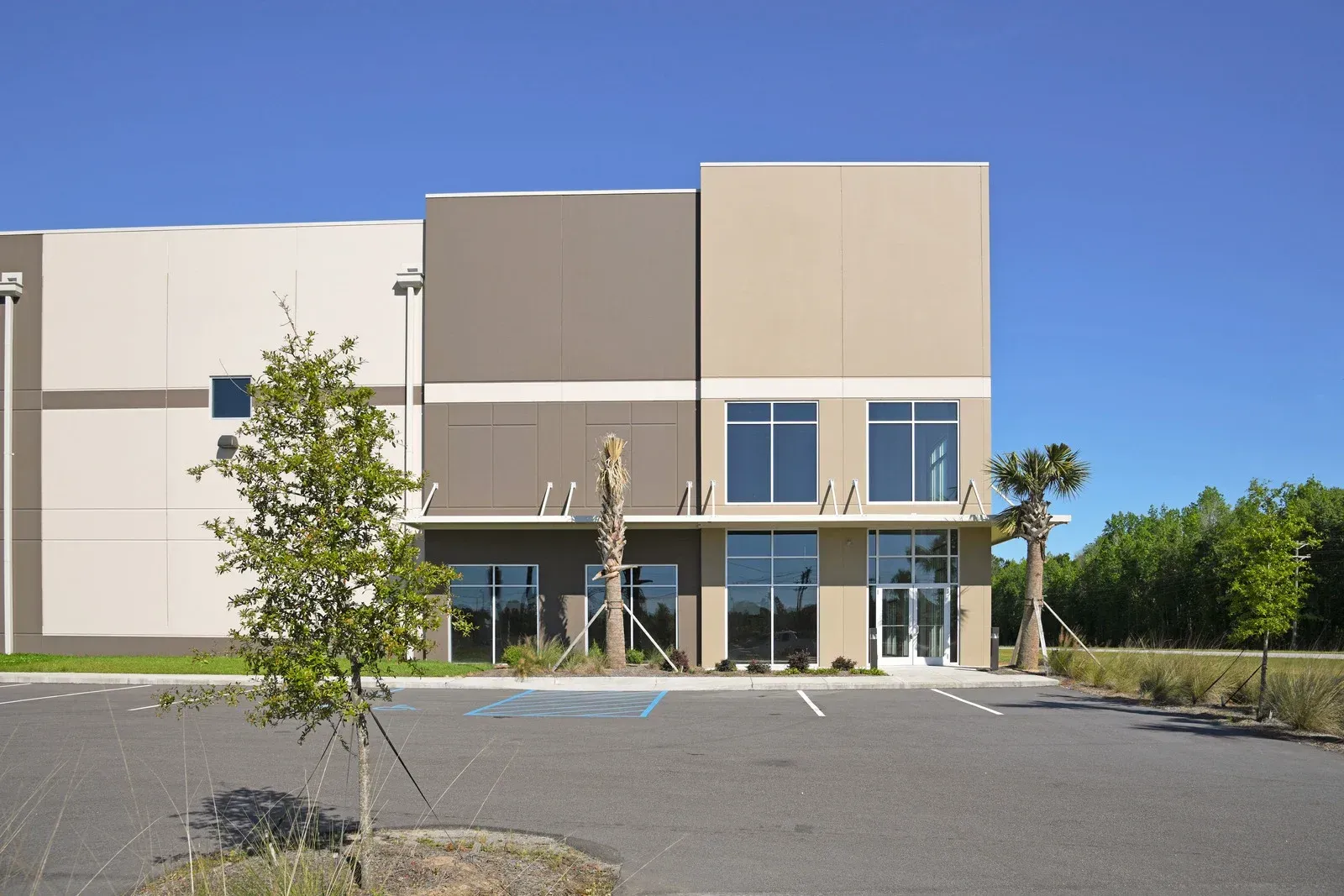A large building with a parking lot in front of it
