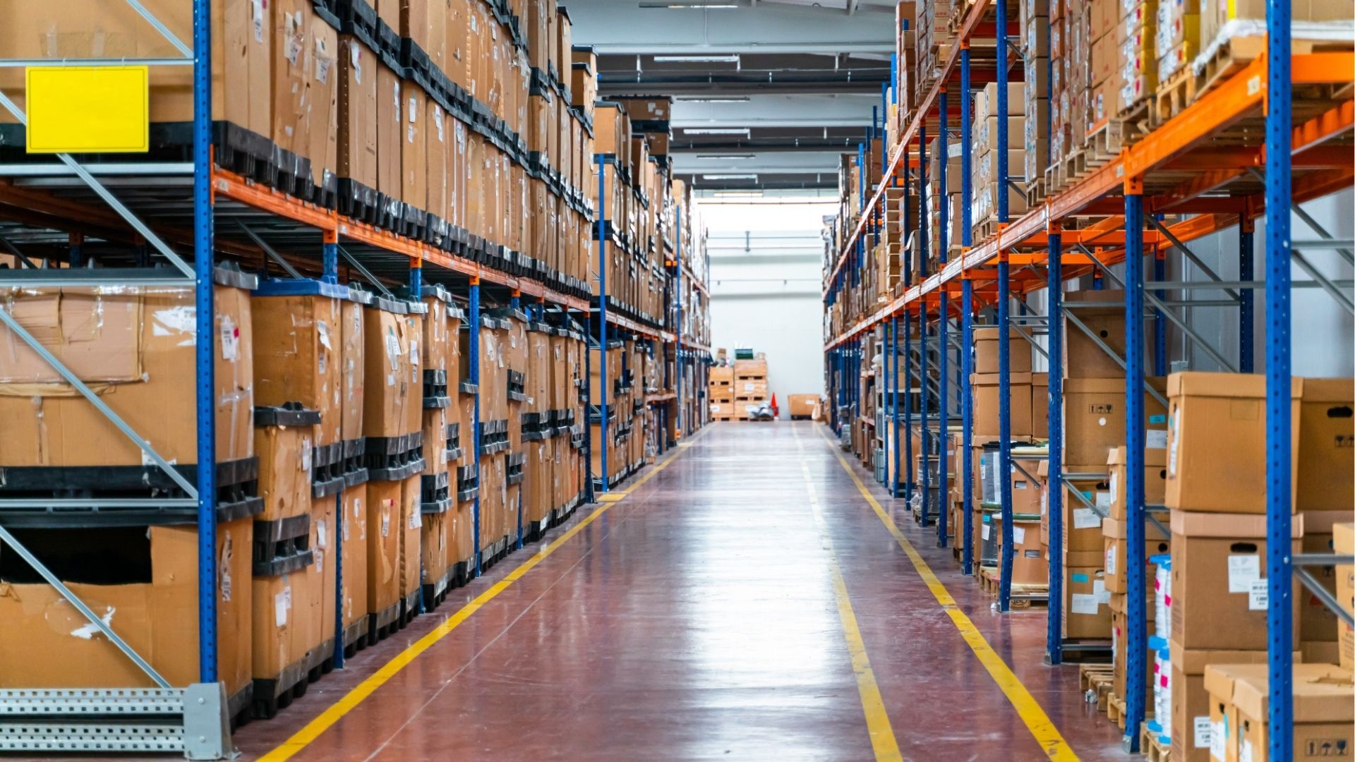 A pile of wood is stacked on top of each other in a yard.