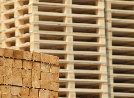 A pile of wooden pallets stacked on top of each other