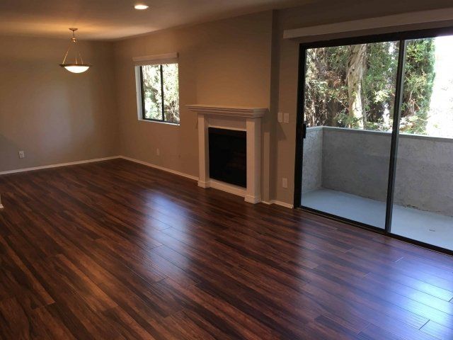 Renovated living room with wood flooring