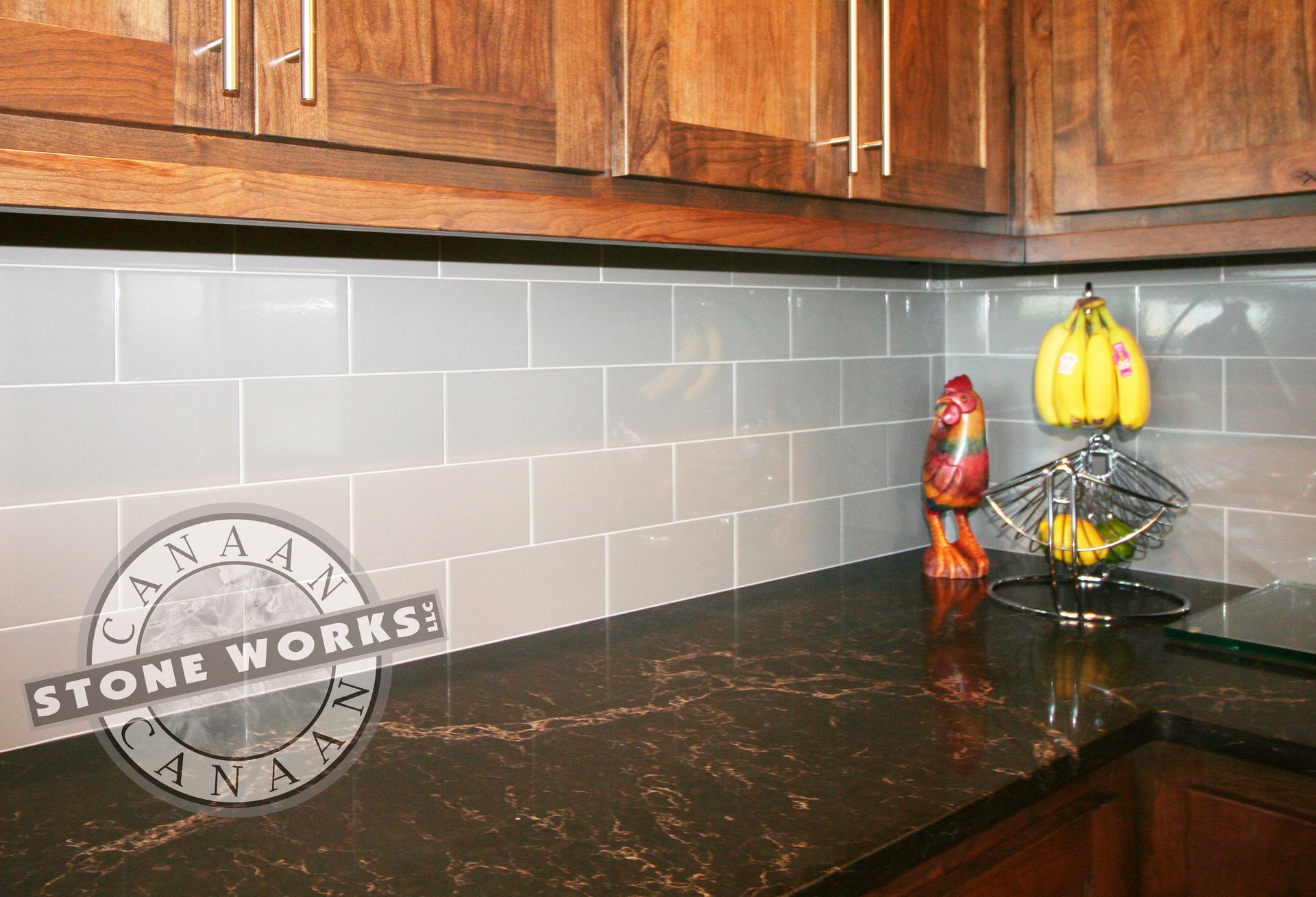 Kitchen countertop, subway tile backsplash, dark granite, rich color,