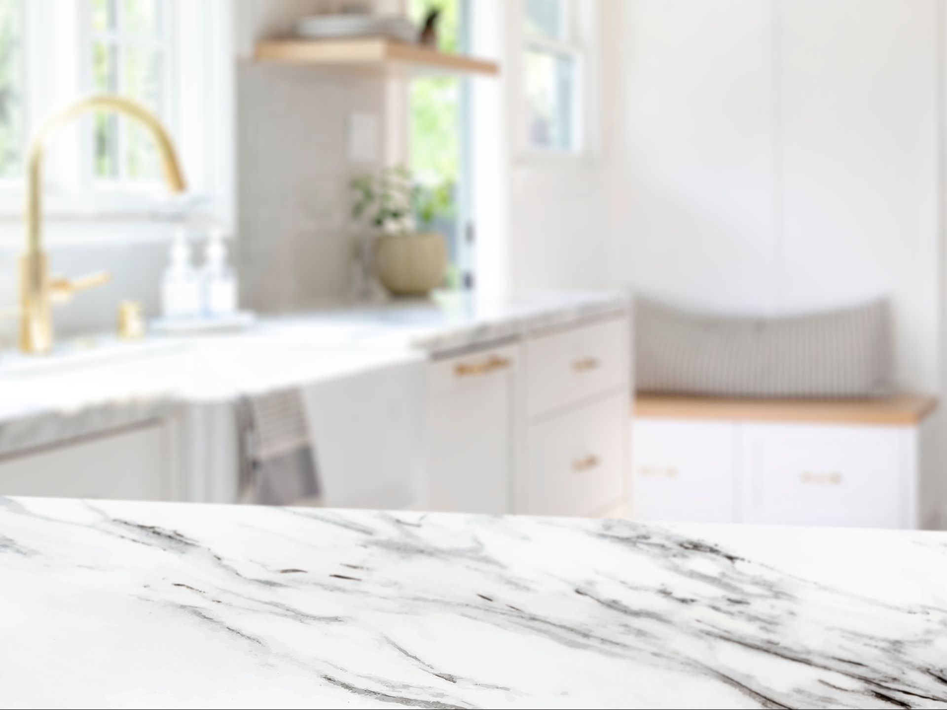 a kitchen with a marble counter top and a sink