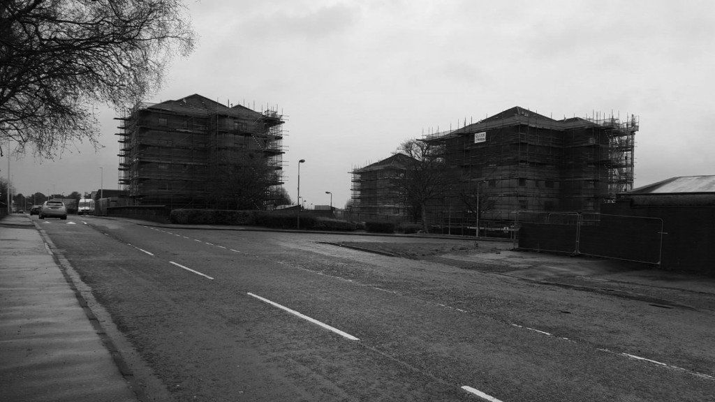 buildings covered in scaffolding