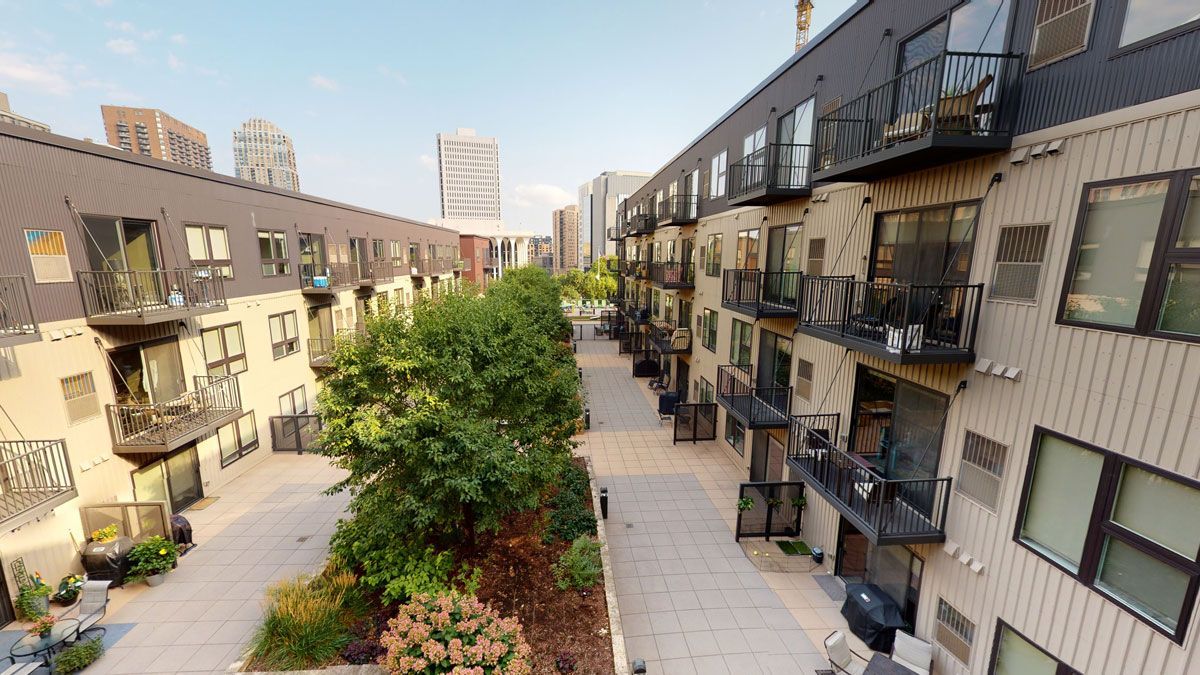 Green foliage in center of property and patio views