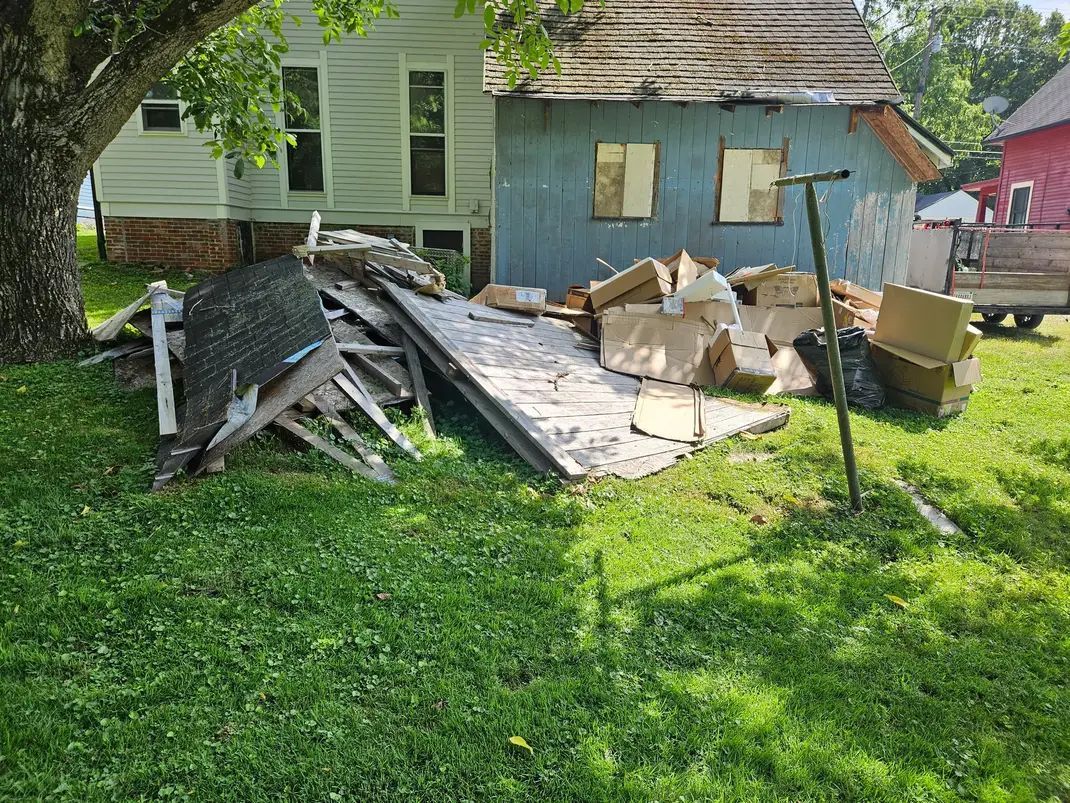 A bunch of different types of batteries are stacked on top of each other.