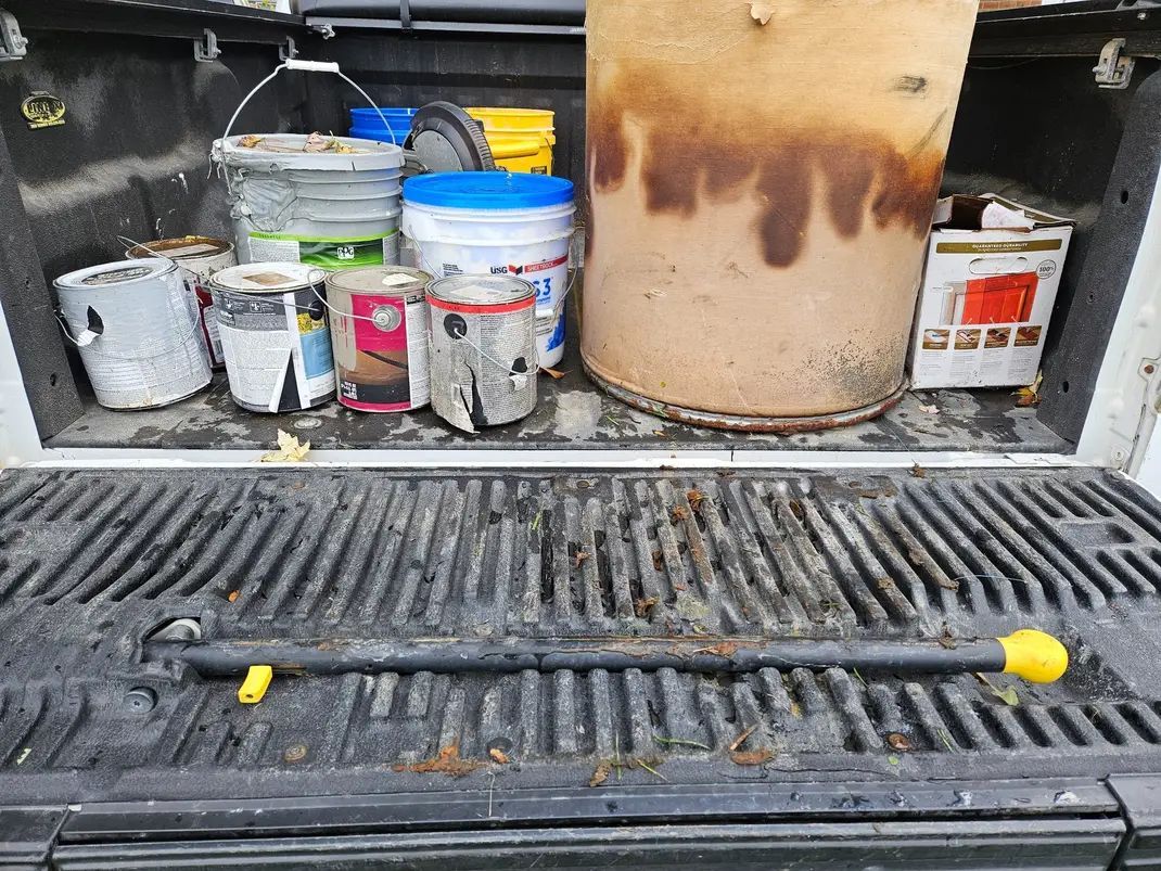 A bunch of bottles with warning labels on them