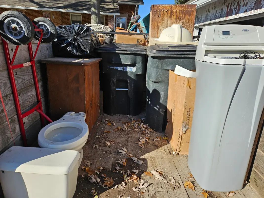 A bunch of different types of batteries are stacked on top of each other.