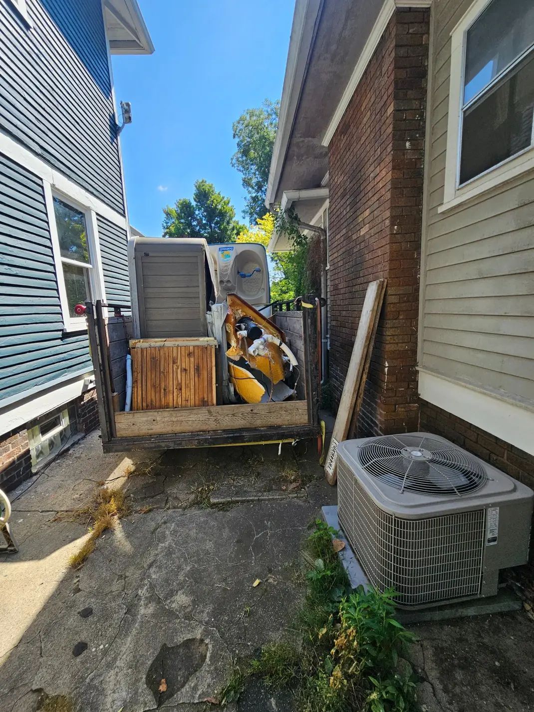 A stack of metal boxes sitting on top of each other in a field.