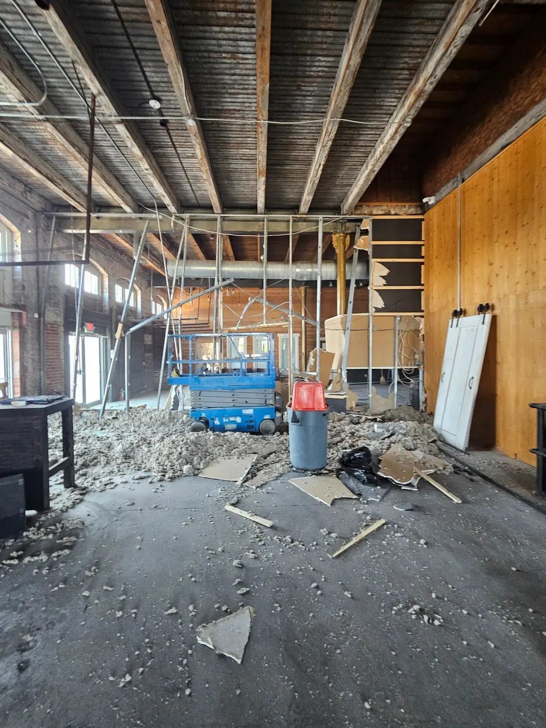 A building under construction with a vacuum cleaner in the middle