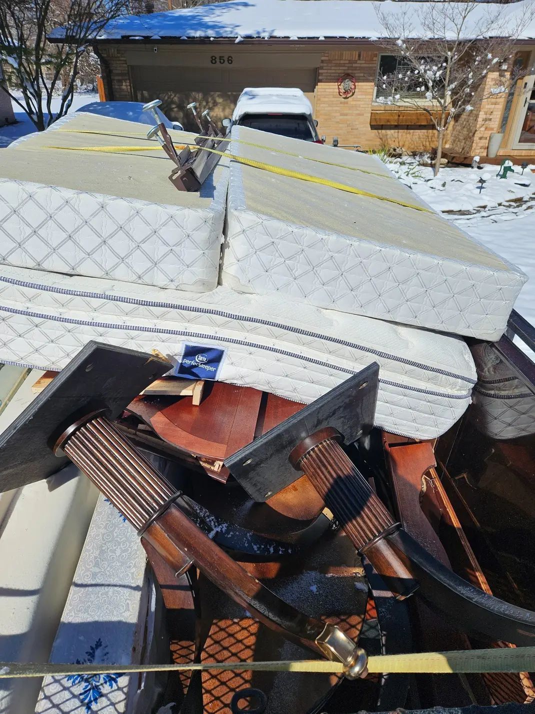 A mattress is sitting on top of a wooden table.