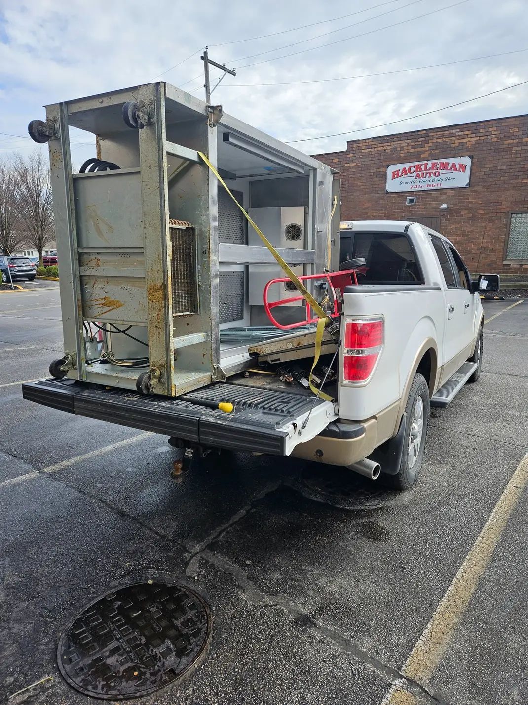 Three buckets of paint are stacked on top of each other.