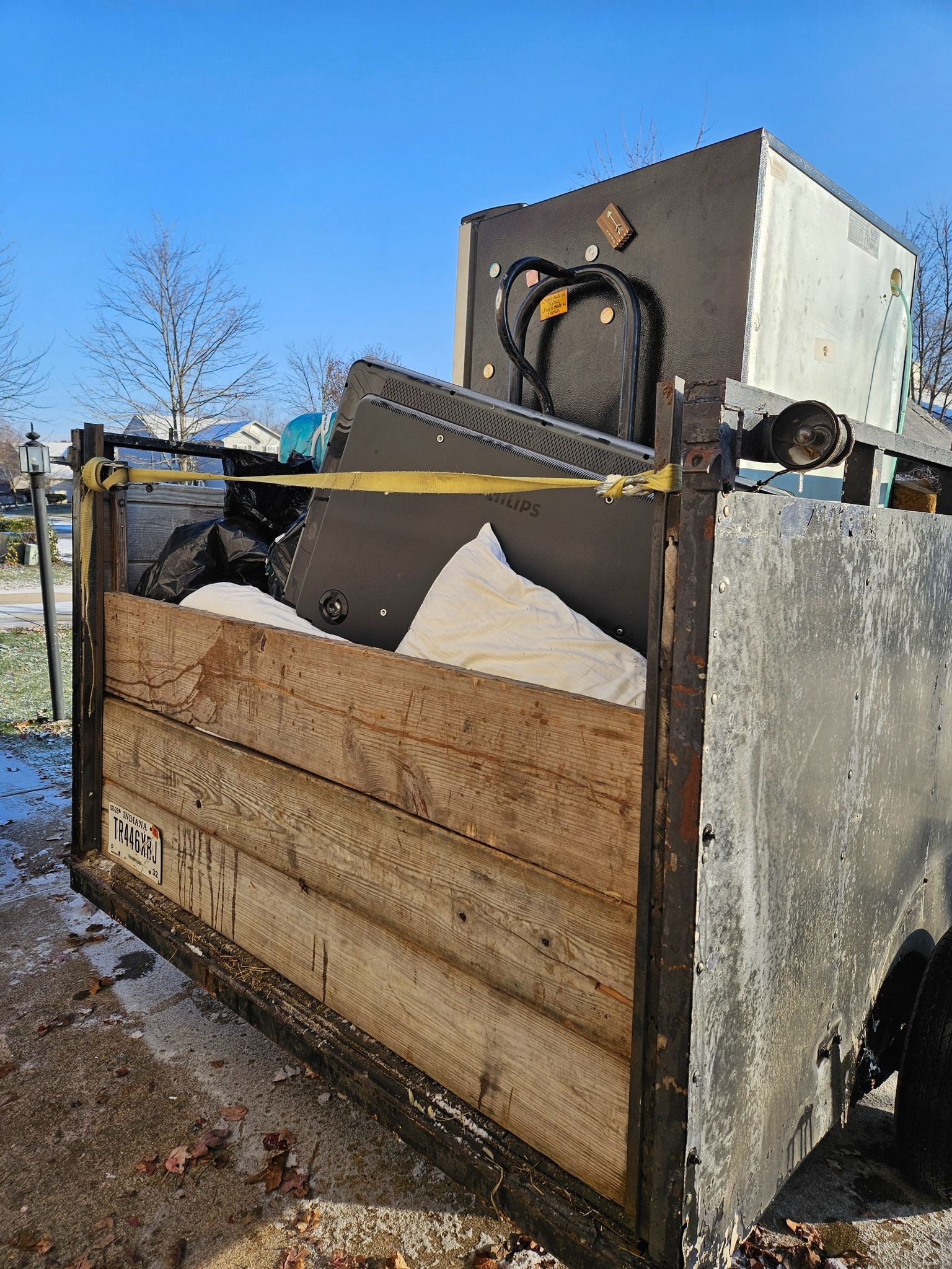 A bunch of different types of batteries are stacked on top of each other.