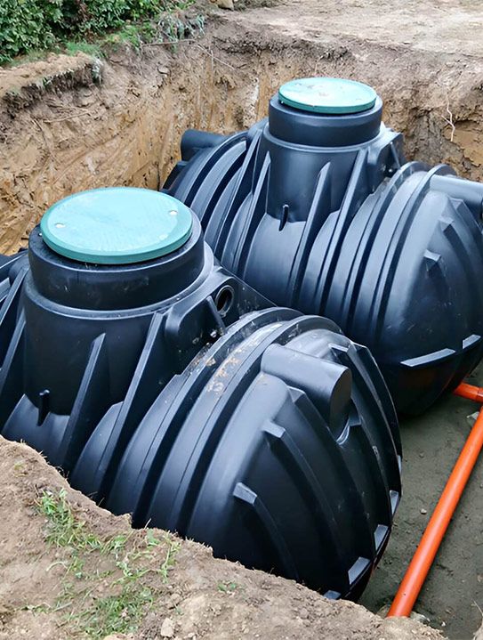 A Couple of Black Tanks are in a Hole in the Ground — Elite Wastewater Solutions in Moss Vale, NSW