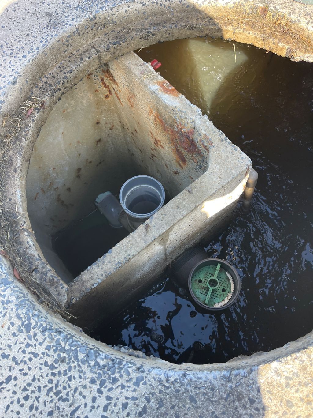 A Close Up of a Pipe With a Blue Valve on It — Elite Wastewater Solutions in Moss Vale, NSW