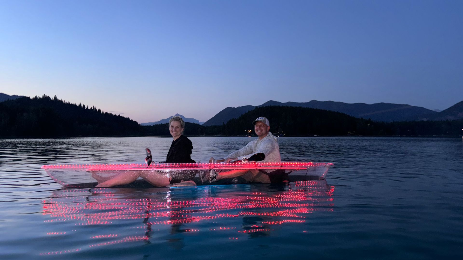 A couple, enjoys the sunset during a kayak tour in Montana