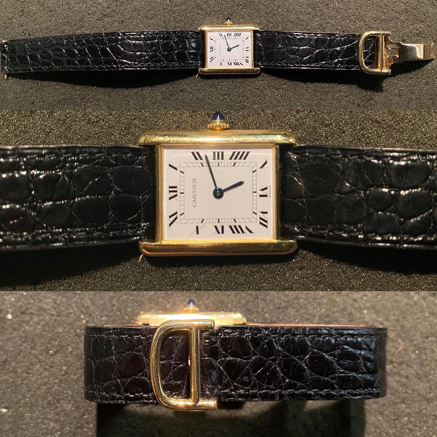 Un orologio Cartier Tank in oro con cinturino in pelle di coccodrillo nera, visto frontalmente, in dettaglio e con la fibbia.
