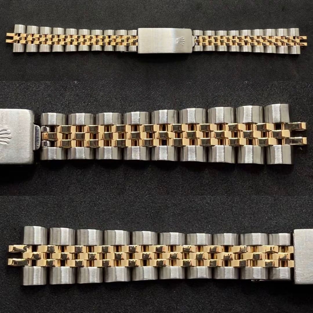 Tre bracciali Rolex Jubilee bicolore in oro e acciaio disposti su uno sfondo scuro.