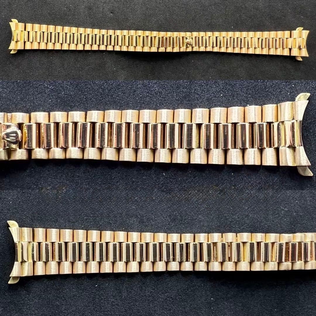 Tre bracciali per orologi in oro di diverse dimensioni, disposti orizzontalmente su uno sfondo scuro e strutturato.