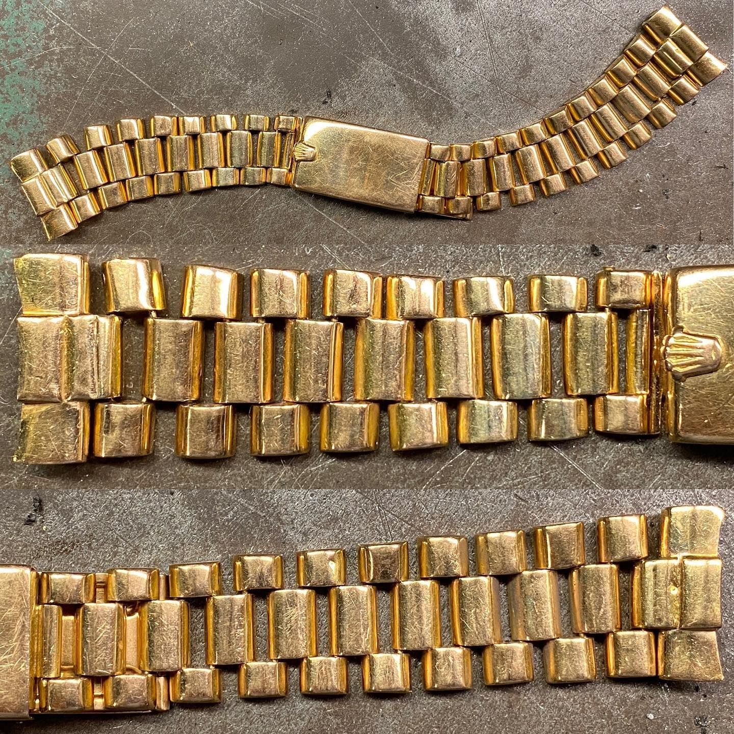 Tre bracciali per orologi color oro disposti orizzontalmente su una superficie scura e ruvida.