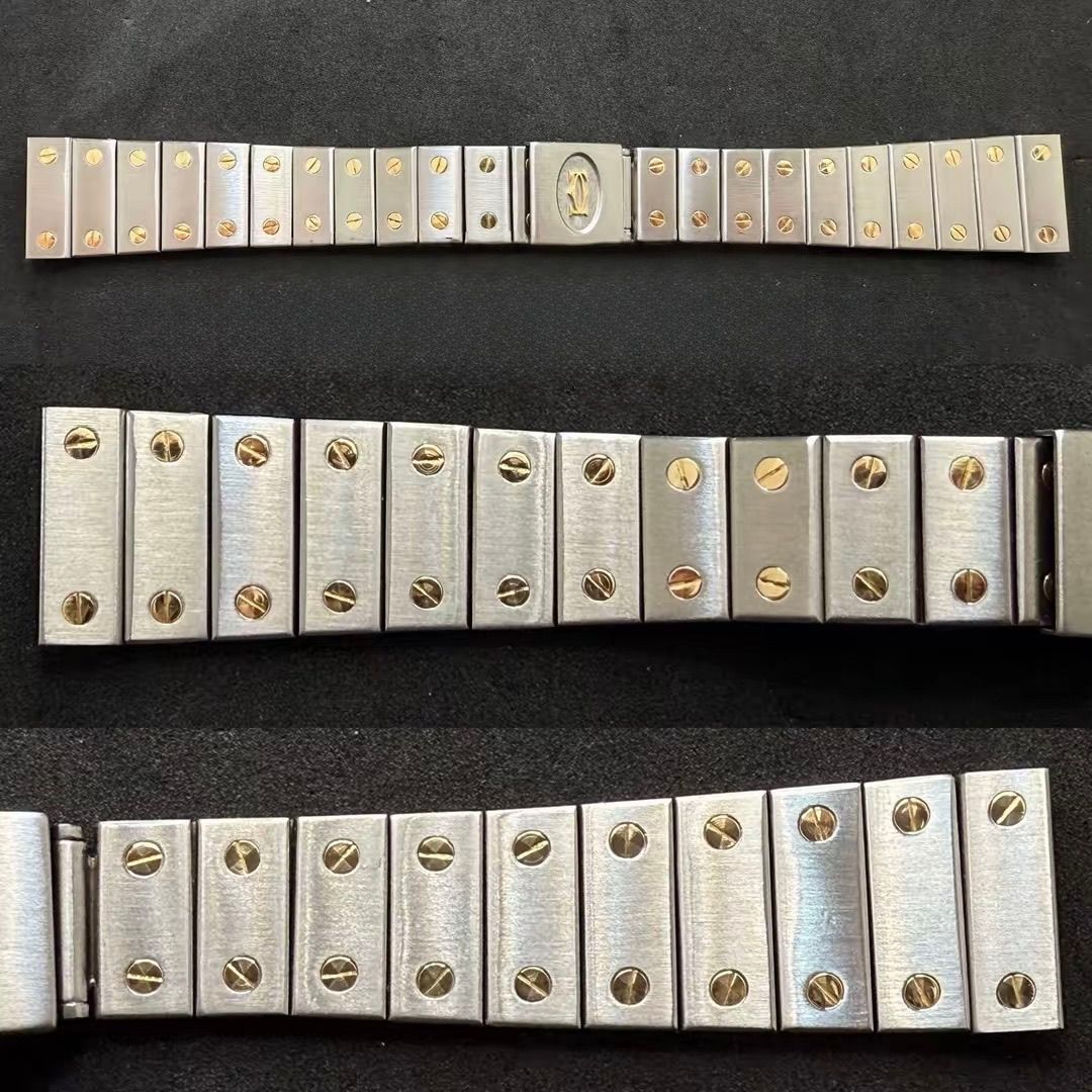 Tre strisce di cinturini per orologi in metallo color argento con dettagli a vite color oro, disposte orizzontalmente su una superficie nera.