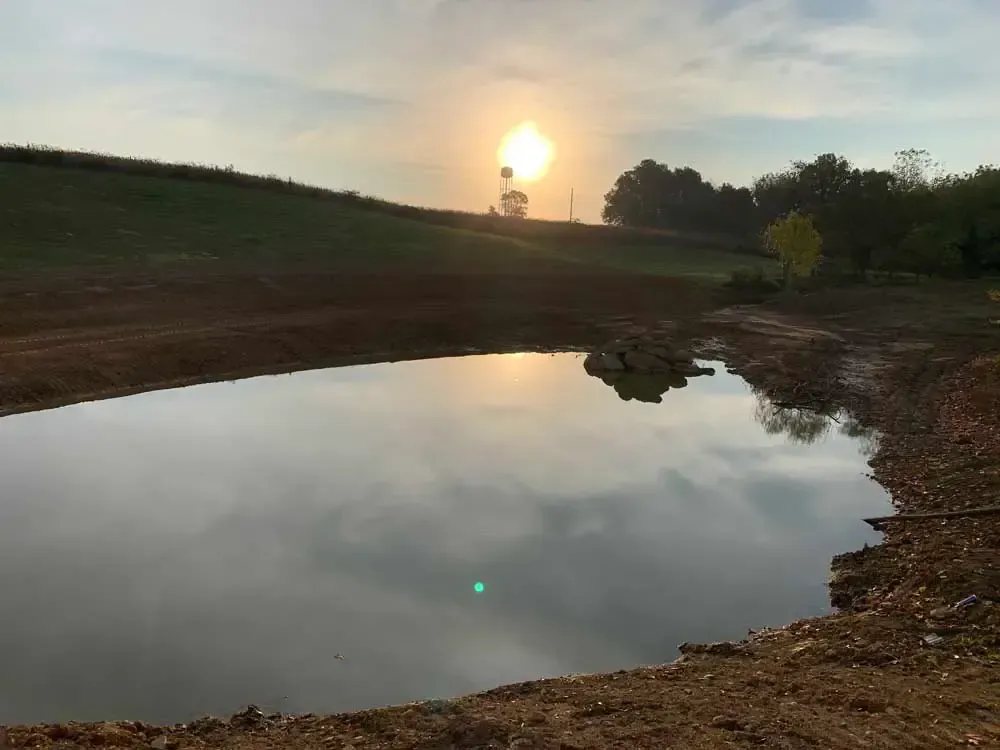 A pond excavation in Madison, IN by Earth Shaping LLC