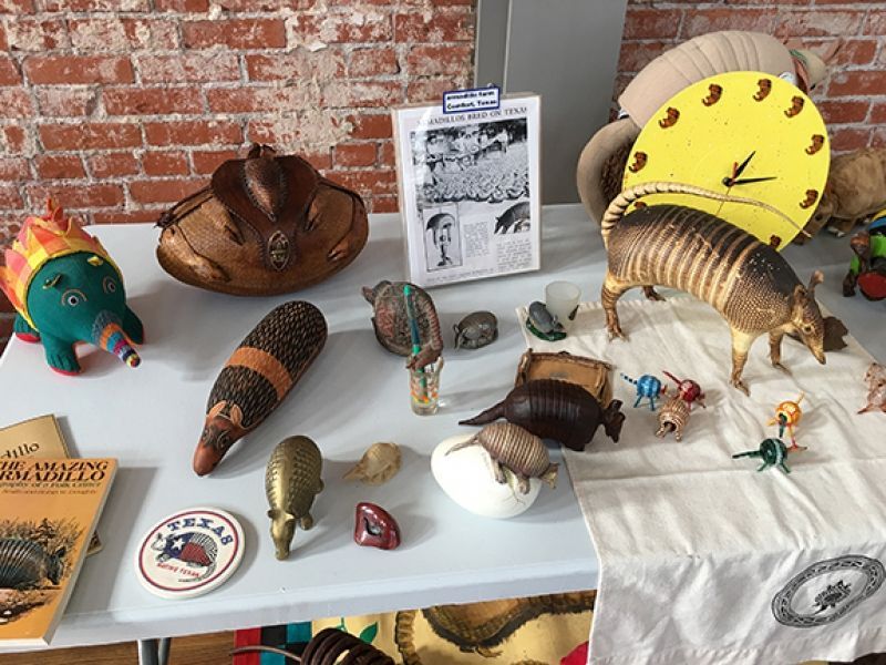 A table with stuffed animals and a clock on it