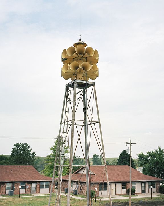 A tower with a bunch of horns on top of it