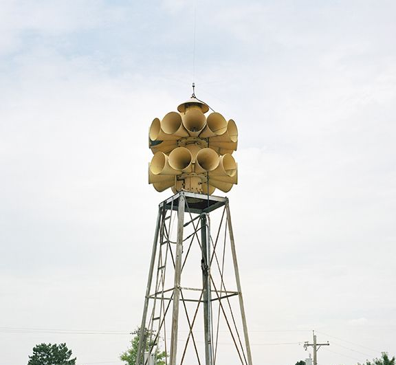 A tower with a bunch of horns on top of it